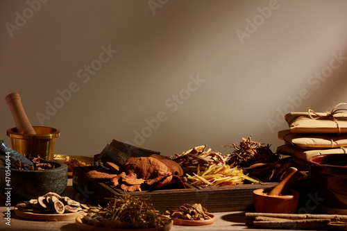 Traditional chinese medicine with herb and spices in light a grey background , for medicine advertising , photography traditional medicine content