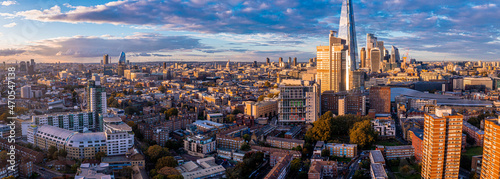 Photography Aerial panorama of the London city financial district with many iconic skyscrapers near river Thames at sunset