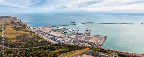 Fotografie Aerial view of the Dover harbor with many ferries and cruise ships entering and exiting Dover, UK