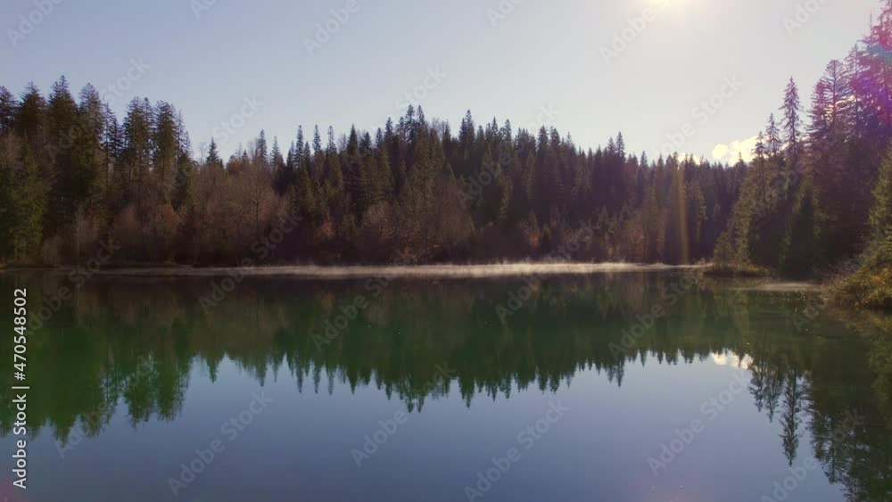 Crestasee Lake in Switzerland Reflecting the Forest in the Emerald Waters Crestasee Lake in Switzerland Reflecting the Forest in the Emerald Waters