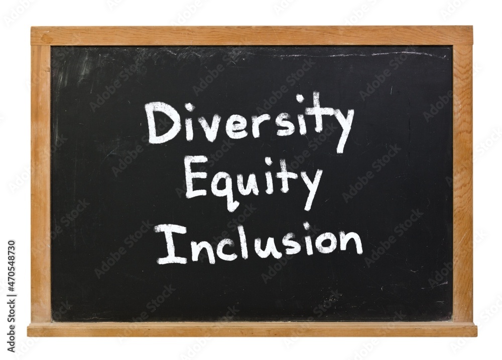 DEI Diversity Equity Inclusion written in white chalk on a black chalkboard isolated on white DEI Diversity Equity Inclusion written in white chalk on a black chalkboard isolated on white