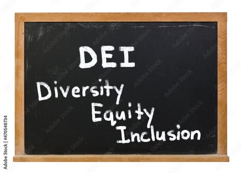 DEI Diversity Equity Inclusion written in white chalk on a black chalkboard isolated on white DEI Diversity Equity Inclusion written in white chalk on a black chalkboard isolated on white