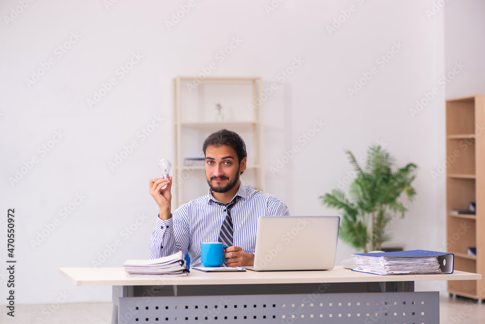 Young male employee in brainstorming concept Young male employee in brainstorming concept