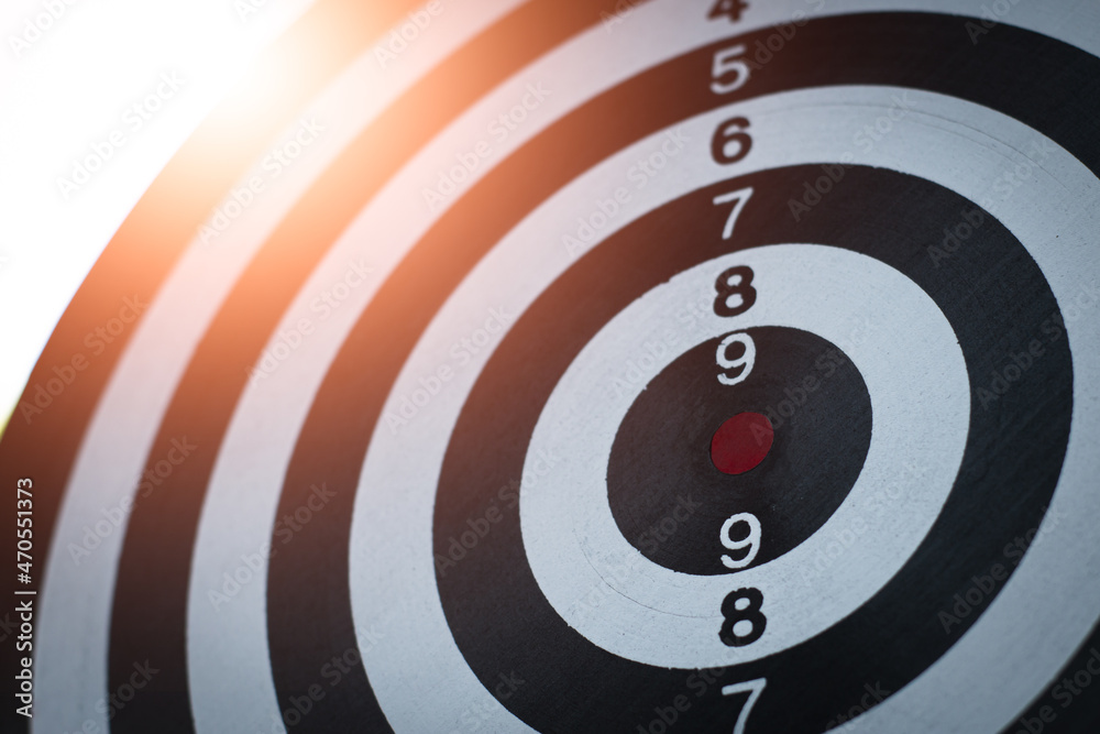 bullseye has red dart arrow throw hitting the center of a shooting for business targeting and winning goals business. bullseye has red dart arrow throw hitting the center of a shooting for business targeting and winning goals business.