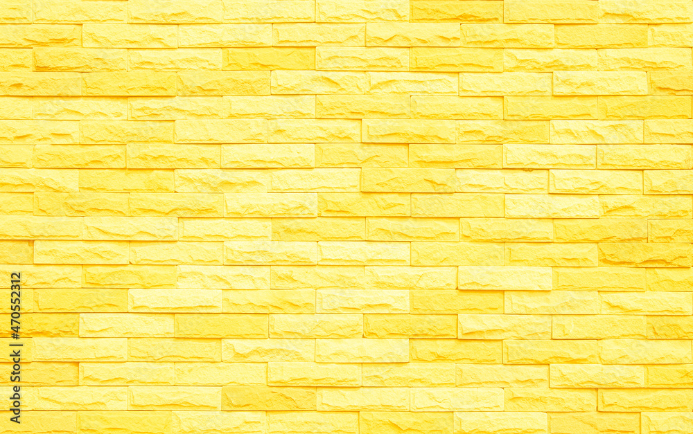 Fototapeta premium Brick wall painted with yellow paint pastel bright tone texture background. 