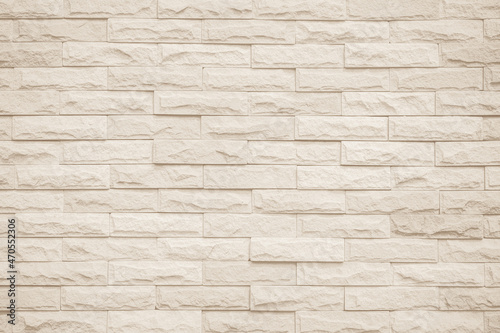 Cream and white brick wall texture background. Brickwork and stonework flooring interior backdrop
