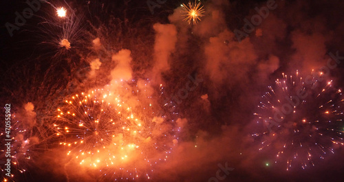 Golden Firework celebrate anniversary happy new year 2022  4th of july holiday festival. Gold firework in the night time celebrate national holiday. Countdown to new year 2022 gold party time event