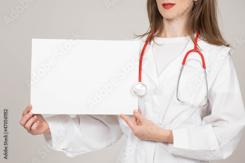 Woman doctor shows banner. ...