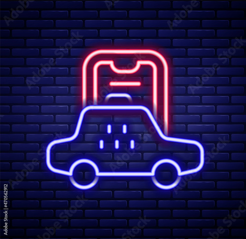Glowing neon line Taxi mobile app icon isolated on brick wall background. Mobile application taxi. Colorful outline concept. Vector