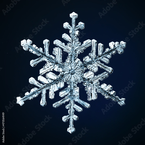 snowflake isolated on black background natural photo crystal winter design photo