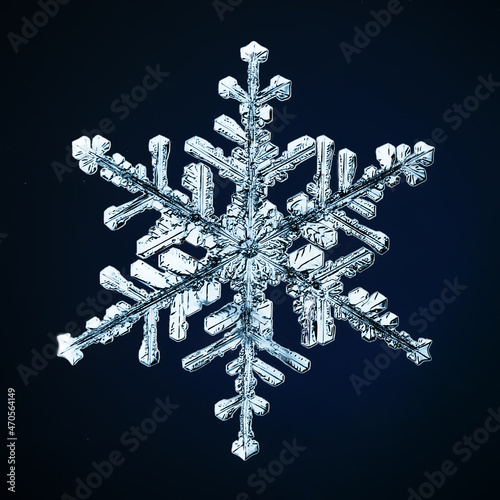 snowflake isolated on black background natural photo crystal winter design