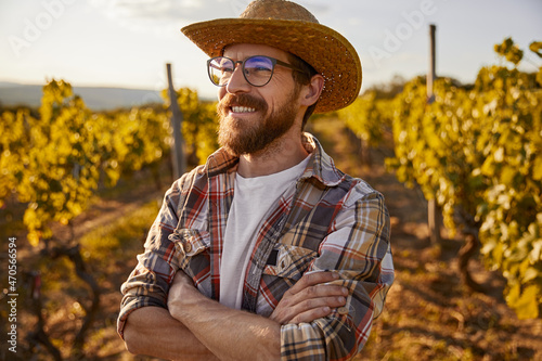 Confident male winemaker on vineyard