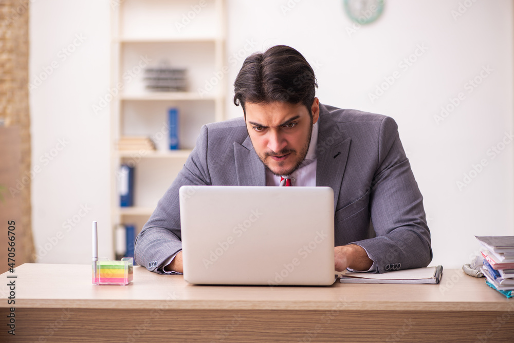 Young businessman employee working in the office Young businessman employee working in the office