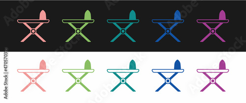 Set Electric iron and ironing board icon isolated on black and white background. Steam iron. Vector