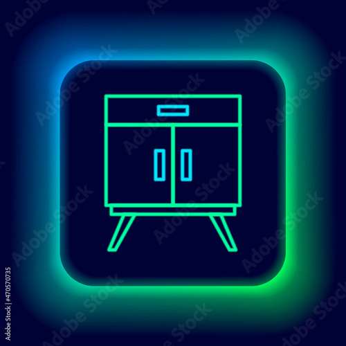 Glowing neon line Chest of drawers icon isolated on black background. Colorful outline concept. Vector