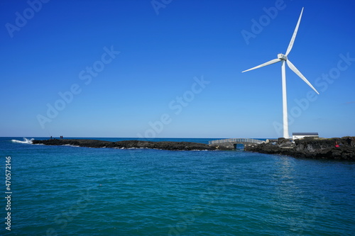 a fascinating seascape with a wind power plant