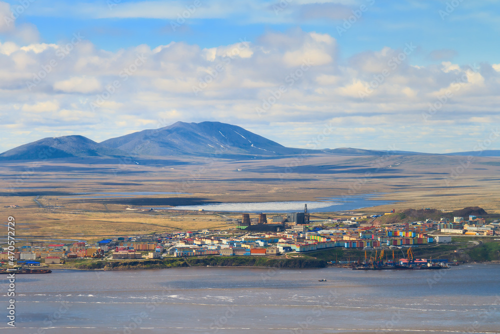 Summer aerial view of the northern arctic port town. Small town in the tundra on the coast. Anadyr is the administrative center of Chukotka and the easternmost city in Russia. Beautiful landscape.