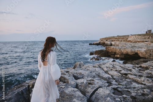 Beautiful woman white dress standing outdoor Lifestyle unaltered © SHOTPRIME STUDIO