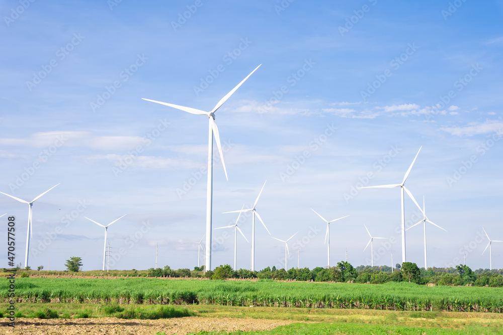 Wind turbines of global ecology with cloud background on the sky. alternative electricity source to be sustainable resources in the future. Clean energy concept saves the world Wind turbines of global ecology with cloud background on the sky. alternative electricity source to be sustainable resources in the future. Clean energy concept saves the world