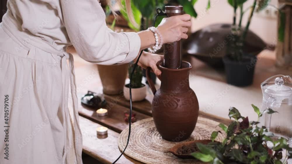 Cacao Ritual Cacao ceremony in atmospheric space with green plants and candles ...