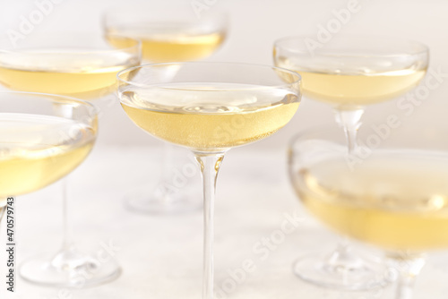 glasses of sparkling champagne on a white background, selective focus.