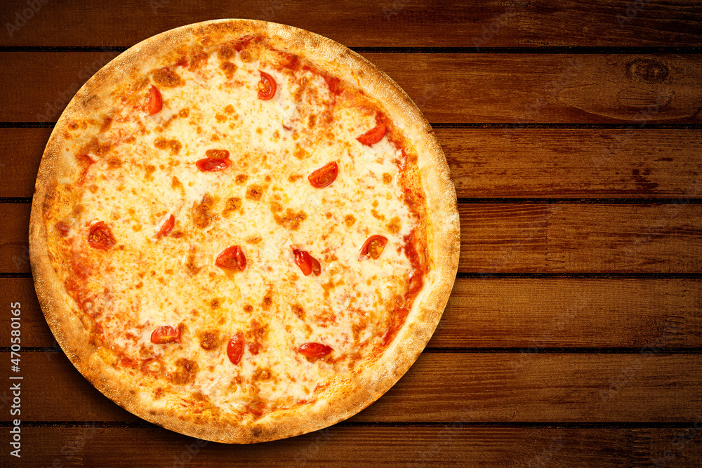 Pizza Margherita top view. Pizza margarita mozzarella cheese on wooden background for pizzeria banner. Flat lay Pizza Margherita top view. Pizza margarita mozzarella cheese on wooden background for pizzeria banner. Flat lay