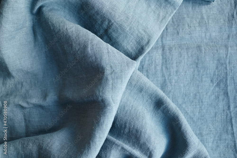 Fototapeta premium Linen fabric with pleats blue color texture