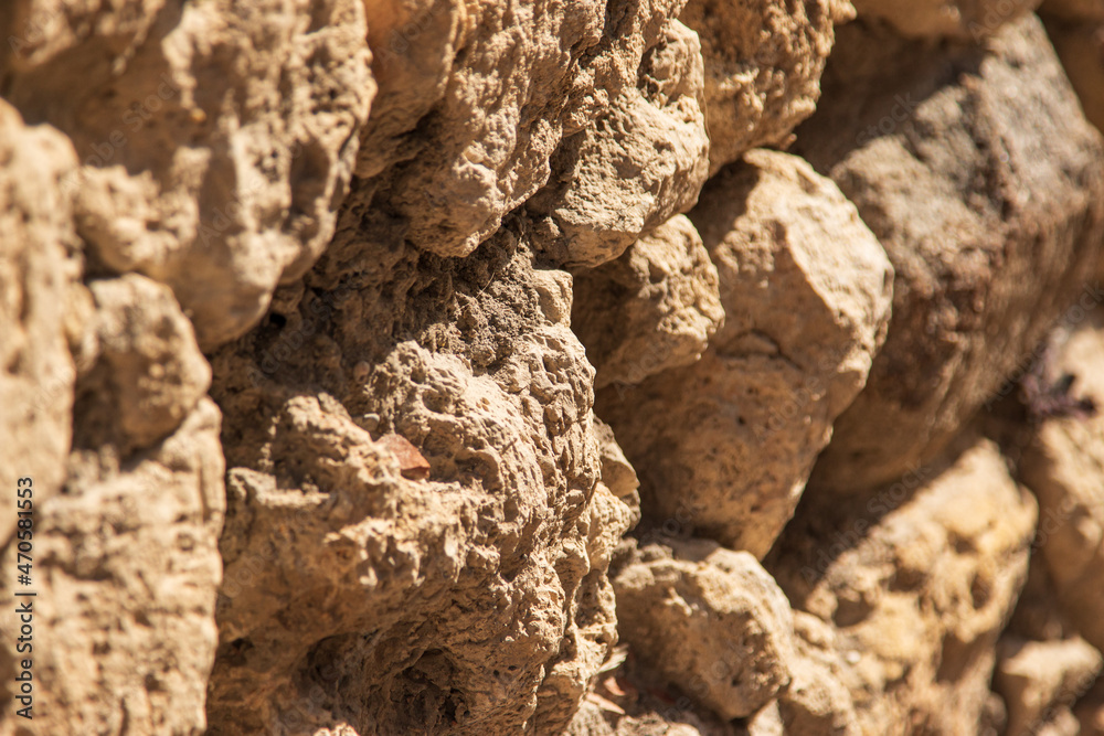 old stones form a wall as a background