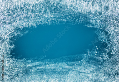 Frost patterns on frozen winter window as a symbol of Christmas wonder. Christmas or New year background.