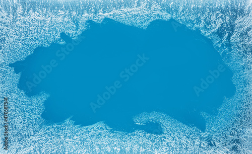 Canvas Print Frost patterns on frozen winter window as a symbol of Christmas wonder