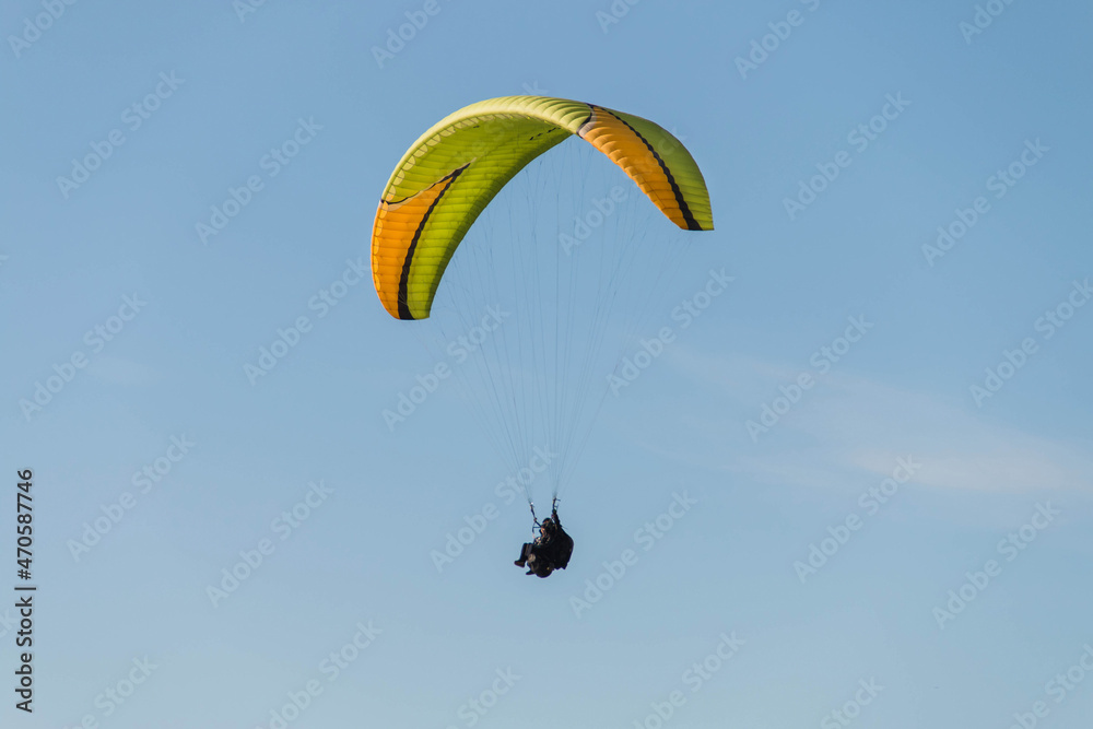Twin paraglider. Paragliding against the blue sky. Twin paraglider. Paragliding against the blue sky.