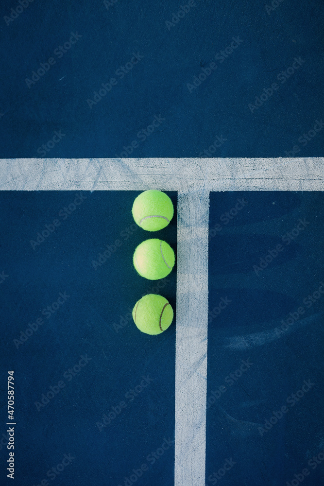 Three yellow tennis balls