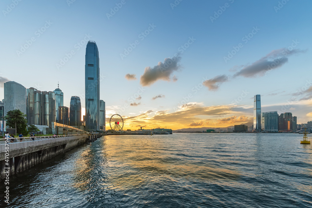 Victoria harbor of Hong Kong city under sunset