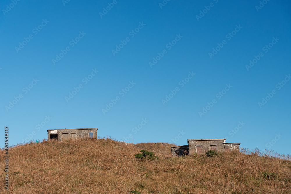 Abandoned stone house under sunset on sunset peak, Lantau Island, Hong Kong. Idyllic landscape Abandoned stone house under sunset on sunset peak, Lantau Island, Hong Kong. Idyllic landscape