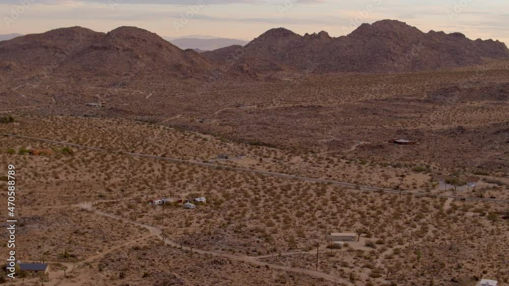 Push towards road and hills beyond in Joshua Tree, California on a beautiful morning. Push towards road and hills beyond in Joshua Tree, California on a beautiful morning.