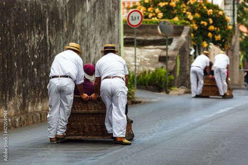 FUNCHAL, MADEIRA - SEPTEMBER 19: Traditional downhill sledge trip on September 19, 2016 in Madeira, Portugal photo