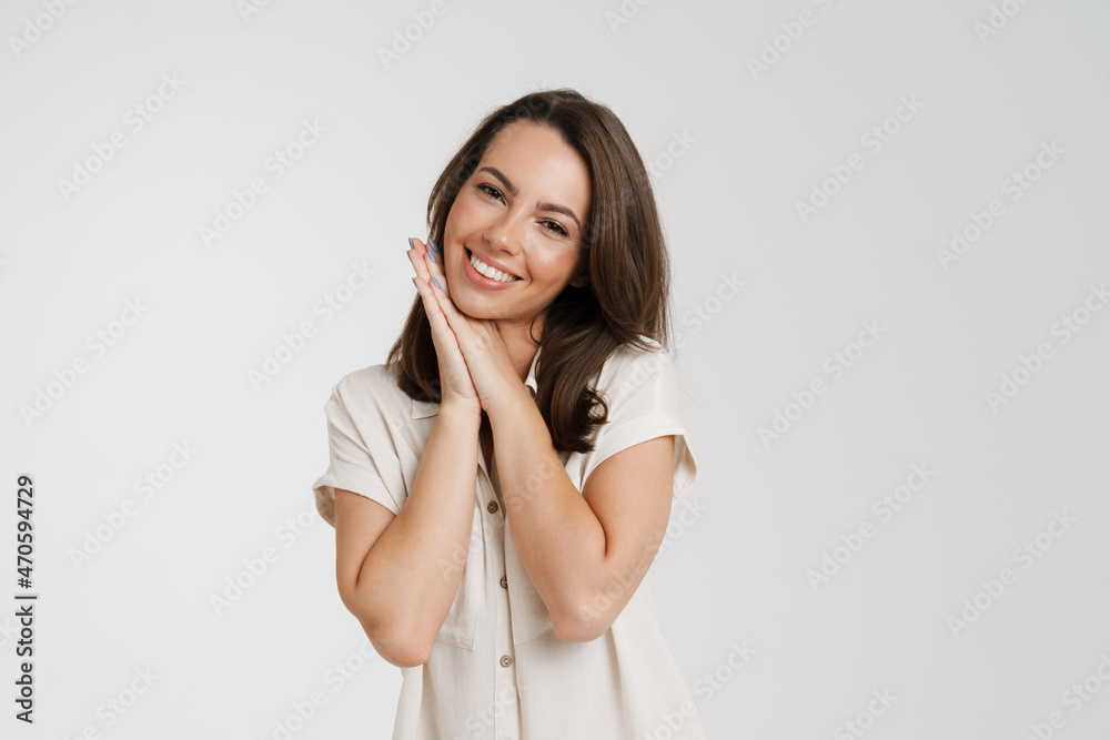 Young european woman in shirt smiling and looking at camera Young european woman in shirt smiling and looking at camera