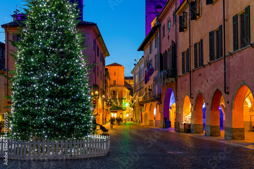 Fototapeta Naklejka Na Ścianę i Meble -  Illuminated Christmas tree on town square in Alba, Italy.