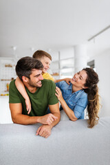 Happy family spending time together, playing at home.