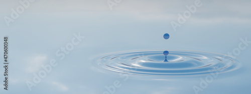 Concept conceptual blue liquid drop falling in water on banner background with ripples and waves. 3d illustration metaphor for nature, natural, summer, spa, cool, business, environment, rain or health