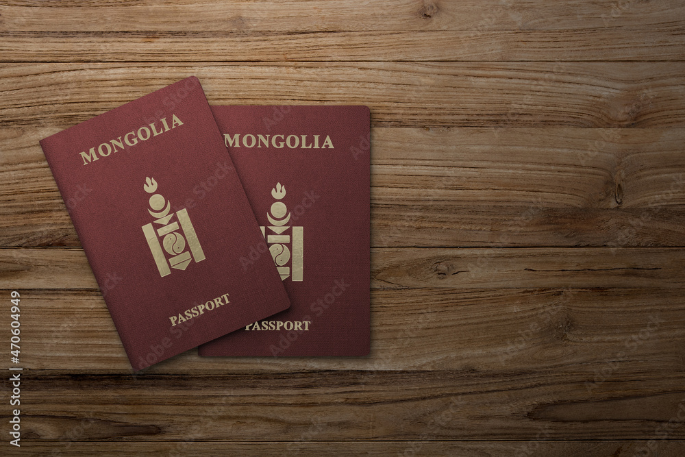 Mongolian passport on a wooden board Mongolian passport on a wooden board