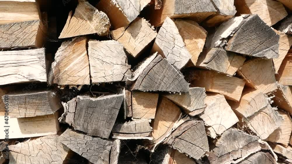 Close-up of wooden firewood stacked in rows. Fuel from logs billet. Natural combustible materials for heating. Selective focus Close-up of wooden firewood stacked in rows. Fuel from logs billet. Natural combustible materials for heating. Selective focus
