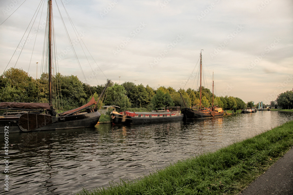 Old sailing boats in a canal in the Netherlands