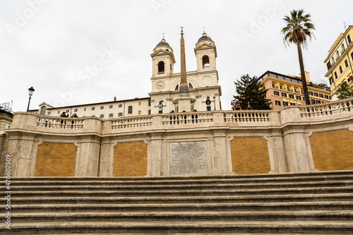 Trinita dei Monti church with Spanish Steps in foreground in a rainy day, Rome, Italy