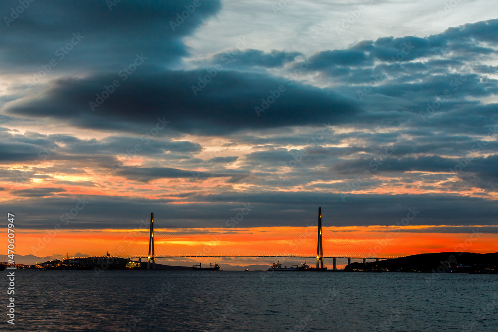 Russian bridge across the Eastern Bosphorus Strait in Vladivostok. Cable-stayed bridge in Vladivostok at dawn. Russian bridge across the Eastern Bosphorus Strait in Vladivostok. Cable-stayed bridge in Vladivostok at dawn.