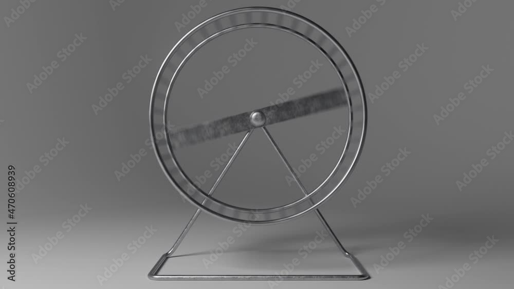 A seamless loop-able animation of a spinning hamster wheel made of metal on an isolated dark studio background A seamless loop-able animation of a spinning hamster wheel made of metal on an isolated dark studio background