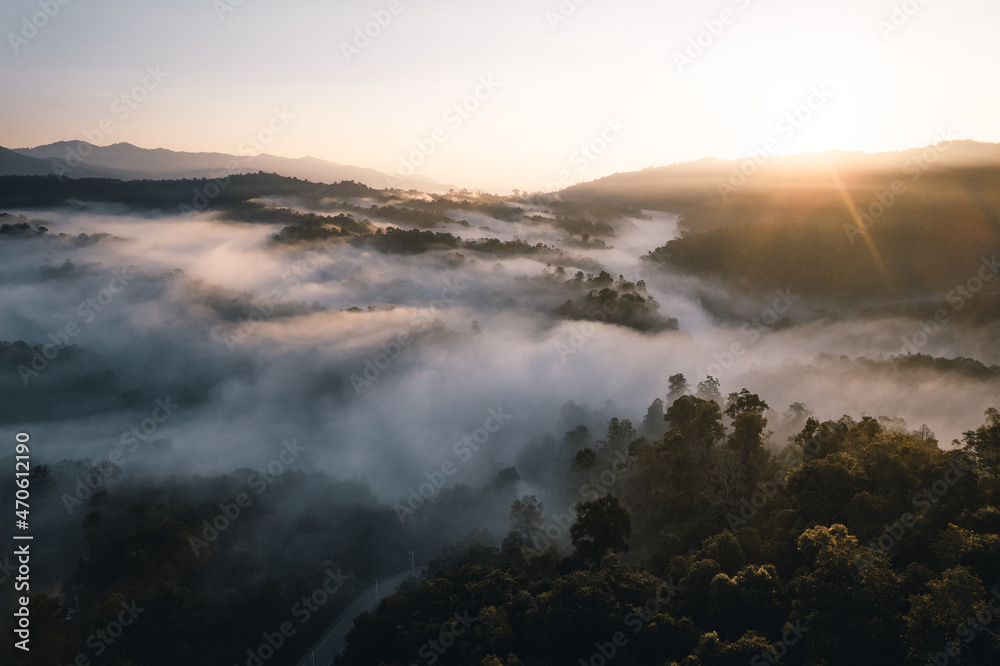 Flying above the clouds sunrise and fog