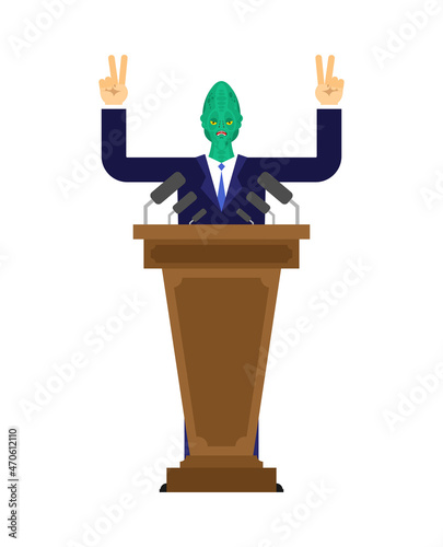 Reptilian speaks from podium. Alien land invaders. Reptilian conspiracy theory. reptiloid humanoid beings from another planet with green skin. theory secret government of reptilians