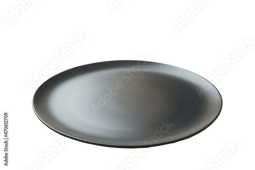 Black ceramic round plate isolated over white background. perspective view