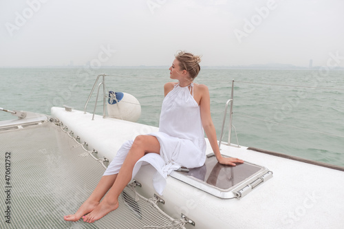 Caucasian woman on luxury white yacht © u photostock